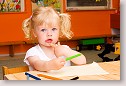 Little girl with crayons